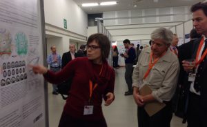 Judith explains her poster to the judging Panel
